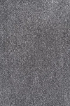 Gray denim fabric texture background. Closeup of dark grey woven cloth with.. Stock Photos