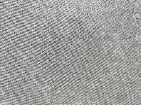 Gray denim texture macro view of intricate twill fabric with detailed threads Foto stock