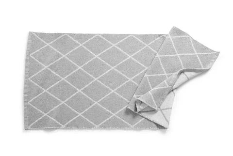 Gray diamond patterned knitted fabric table runner with folded corner, home d Stock Photos