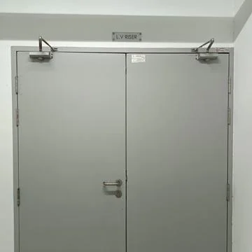 Gray double doors labeled “L.V. ROOM” Stock Photos
