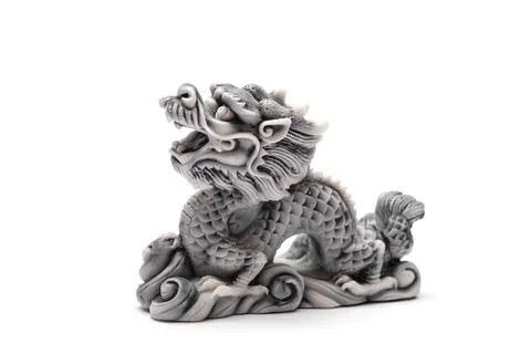 Gray dragon statue on a white background. The symbol of 2024. Stock Photos
