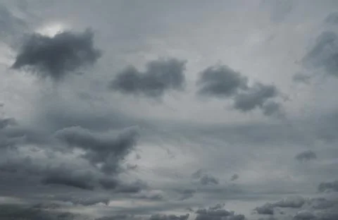 Gray dramatic overcast sky. Beautiful dramatic cloudscape over horizon, sky. Stock Photos