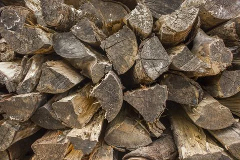 Gray dry logs of firewood in the stack. natural surface texture Foto stock