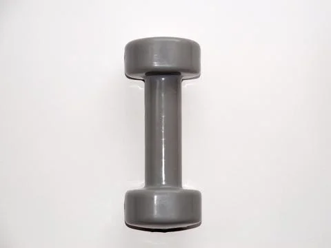 Gray dumbbell on a white background copy space Stock Photos