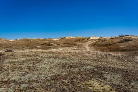 The Gray Dunes, or the Dead Dunes is sandy hills with a bit of green specks a Stock Photos