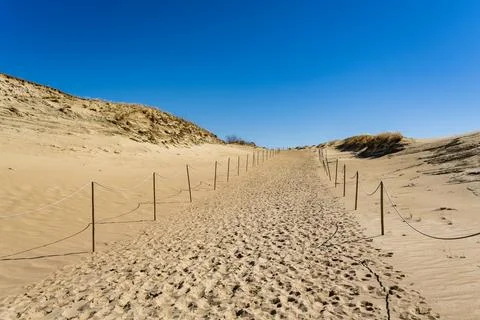 The Gray Dunes, or the Dead Dunes is sandy hills with a bit of green specks at Stock Photos