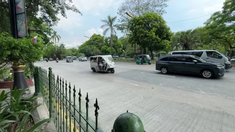 Gray electric e-trike public transit driving in Manila 4K Vídeos de archivo 337450944