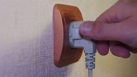 Gray electric plug stick in the socket and pull out Stock Footage 102913370