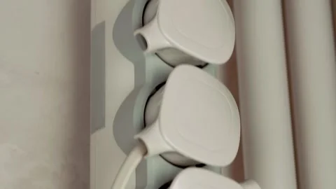 A gray electrical extension cord with multiple sockets and a power button Video stock 297823810