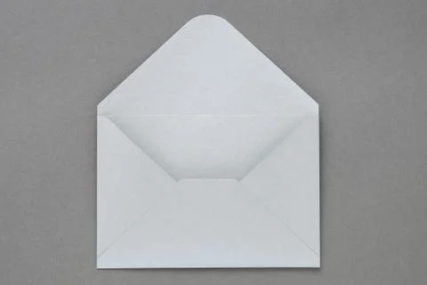 Gray envelope on dark gray background. Stock Photos