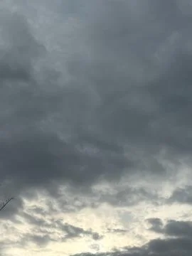 Gray Evening Clouds with Warm Light at Horizon Stock Photos