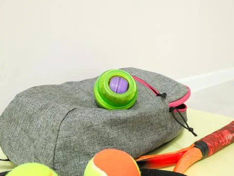 Gray Fabric Backpack With Pink Zipper, Bright Green Toy Container, Colorful Stock Photos