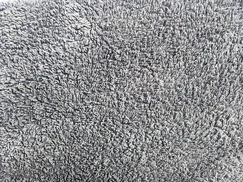 Gray fabric carpet texture close up soft textile background Stock Photos