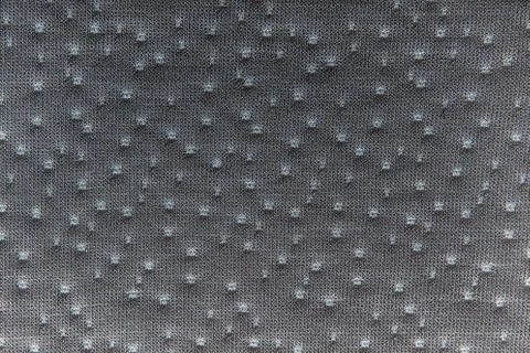 Gray fabric dotted texture. Close up Stock Photos