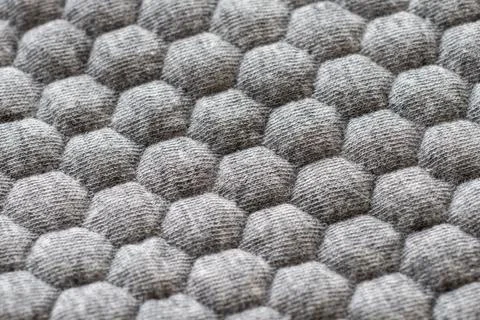 Gray fabric with hexagonal pattern Stock Photos