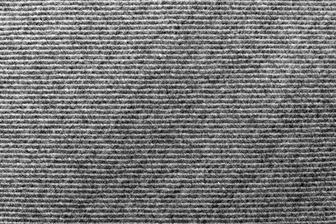 Gray fabric. Material for tailoring. Pattern with straight small dark Stock Photos