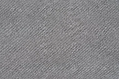 Gray fabric texture with diagonal weave pattern 库存照片