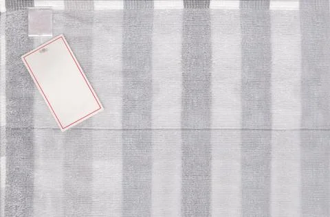 Gray fabric texture of textiles scots pattern and have paper label. Stock Photos