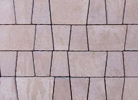 Gray facing tiles in the wall background Stock Photos