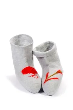 Gray felt socks with a pattern on a white background Stock Photos