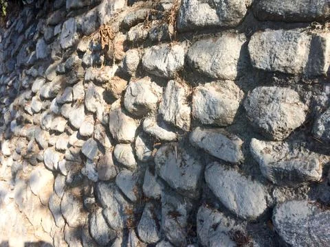 Gray fieldstone wall background pattern of stone Stock Photos