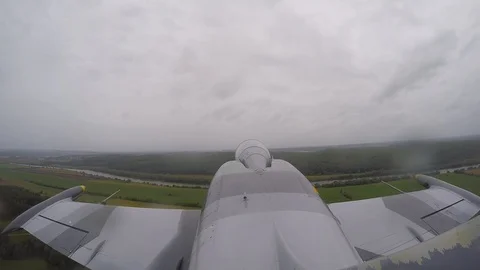 Gray fighter plane flies in sky. Top view from tail fin close up. Game concept. Stock Footage 118677241