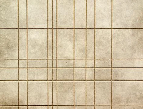 Gray fine-grained surface, divided into irregular rectangles. Stock Photos