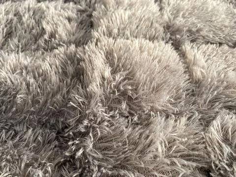 Gray fluffy carpet. usually placed on the floor Stock Photos
