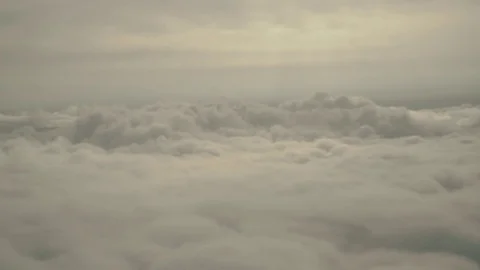 Gray Fluffy clouds from the flying airplane window in summer Stock Footage 81609029