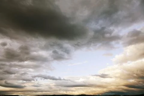 Gray fluffy clouds in the sky Stock Photos