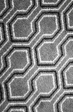 Gray geometric carpet pattern, top view, background texture Stock Photos