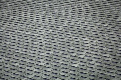 A gray geometric texture with the same rectangles. Close-up of a roof made of Stockfoto's