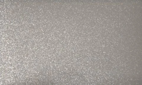 Gray glossy plain background. Metallic. Texture.Close-up shot. Stock Photos