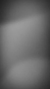 Gray gradient grainy vertical background texture with blurred abstract and .. Foto stock