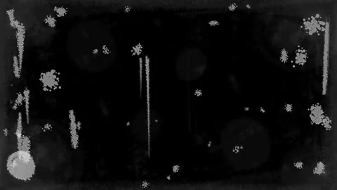 Gray grainy spots on a black background. Texture of a cracked plastic surface. Stock Footage 339022232