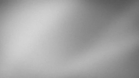Gray grainy textured background with smooth gradient blur in 4K resolution .. Stock Photos