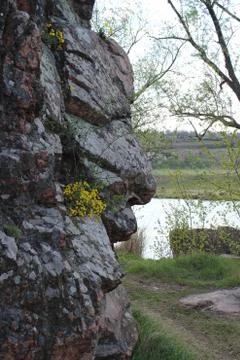 Gray granite rocks in the shape of human face Photos