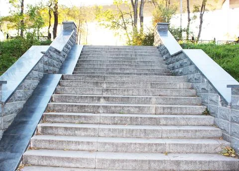Gray granite steps in the city Closeup granite staircase, old staircase detail Stock Photos