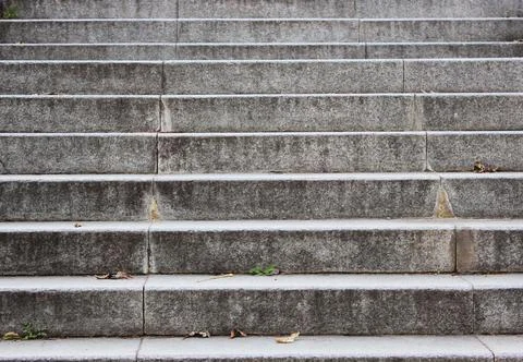 Gray granite steps in the city Closeup granite staircase, old staircase detail Stock Photos