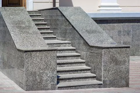 The gray granite steps of the staircase at the back entrance. Stock Photos