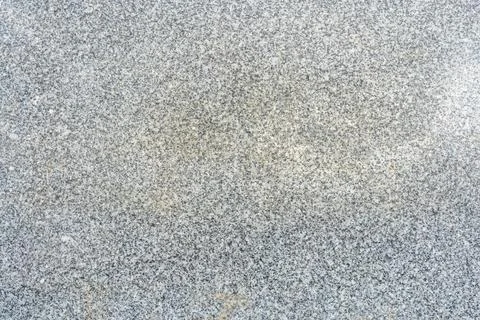 Gray granite stone surface texture with natural mineral grain patterns Stock Photos