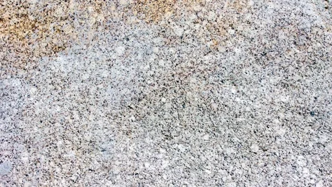 Gray granite with yellow spots. Granite rock texture, cobblestone,animation Stock-Footage 341590128
