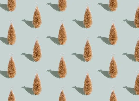 Gray green background pattern, Christmas, New Year small toy golden fir trees Stock Photos