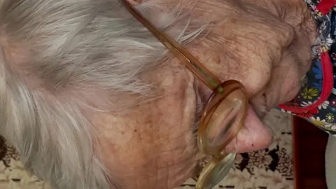 A gray-haired 90-year-old lady Stock Footage 194577473