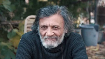 A gray-haired grandfather looking at the camera and winks Stock Footage 85670525