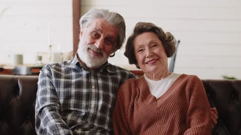 Gray-haired husband hugging his wife, couple in love enjoying a tender moment Stock Footage 244449358