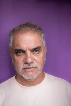 Gray-haired man between 50 and 60 years old with a serious look. An adult w.. Stock Photos