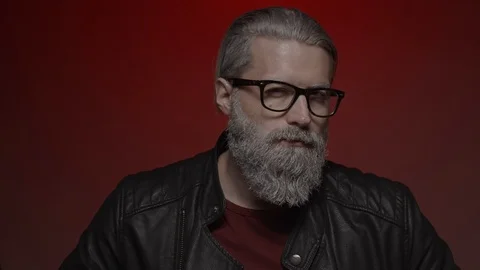 Gray haired man in glasses Video stock 124792404
