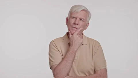 Gray haired man in a thoughtful pose, hand at chin studio shot Stock Footage 263931289