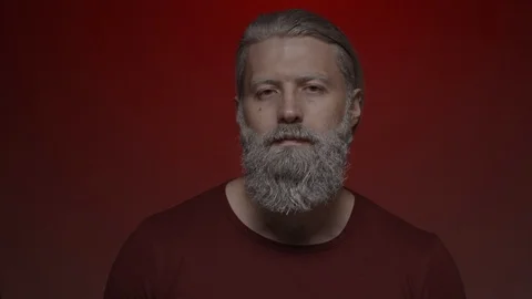Gray haired man wears glasses Video stock 124792429